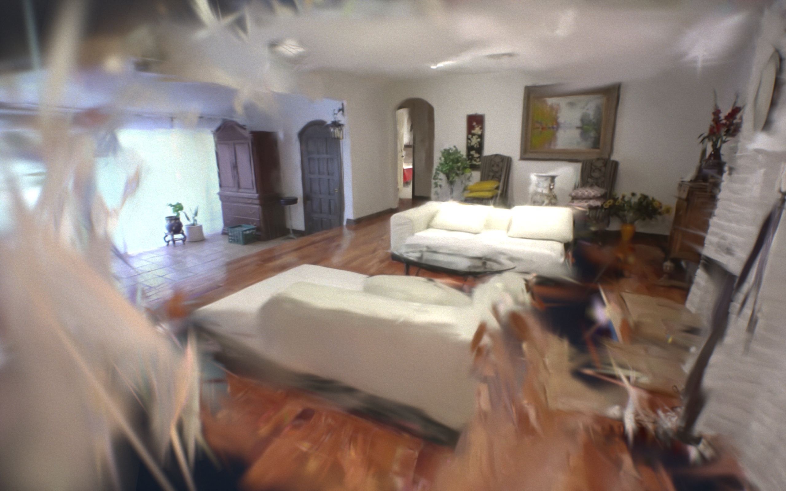 A digitally rendered bedroom with soft lighting, featuring a neatly made bed, abstract wall art.