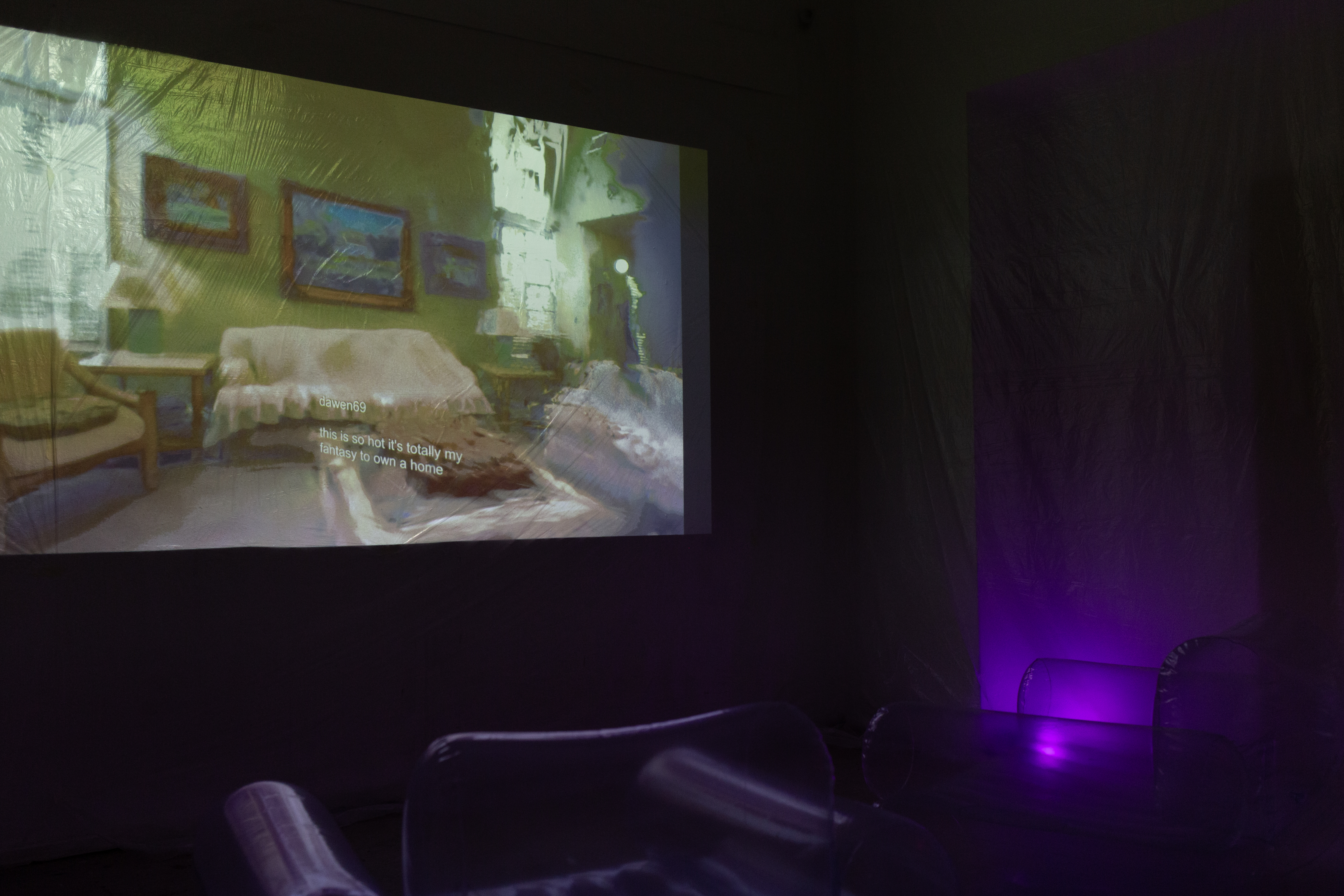 A studio space with a projection of the fantasy lane project, showcasing a blend of digital and physical elements. Purple lighting creates an ethereal atmosphere, enhancing the immersive experience.